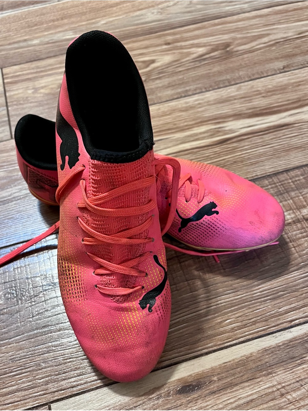 Puma Bright Pink Soccer Cleats with Black Puma Logos